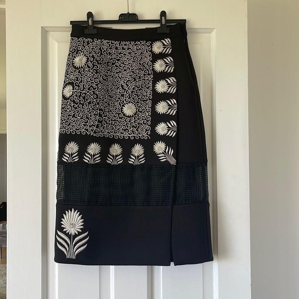 3 skirts from Prada, Carven, Rahul Mishra. Gently used.